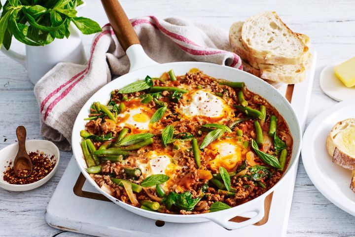 Baked eggs in spicy beef sauce