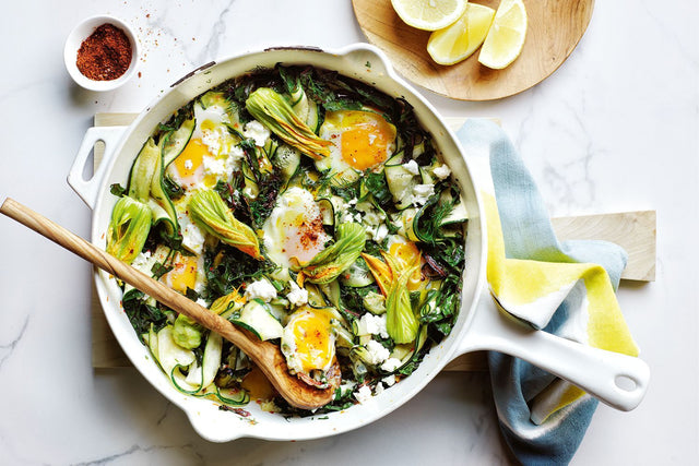 Braised eggs with zucchini and feta